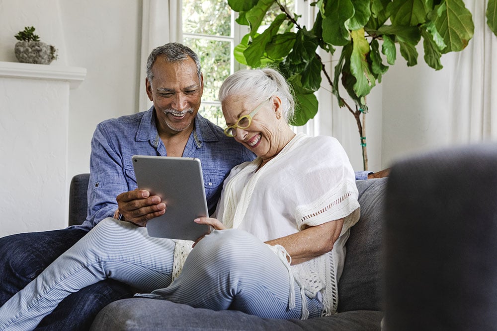 Older couple using a tablet together