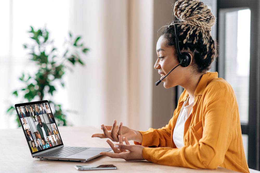 Woman wearing a headset on a remote meeting